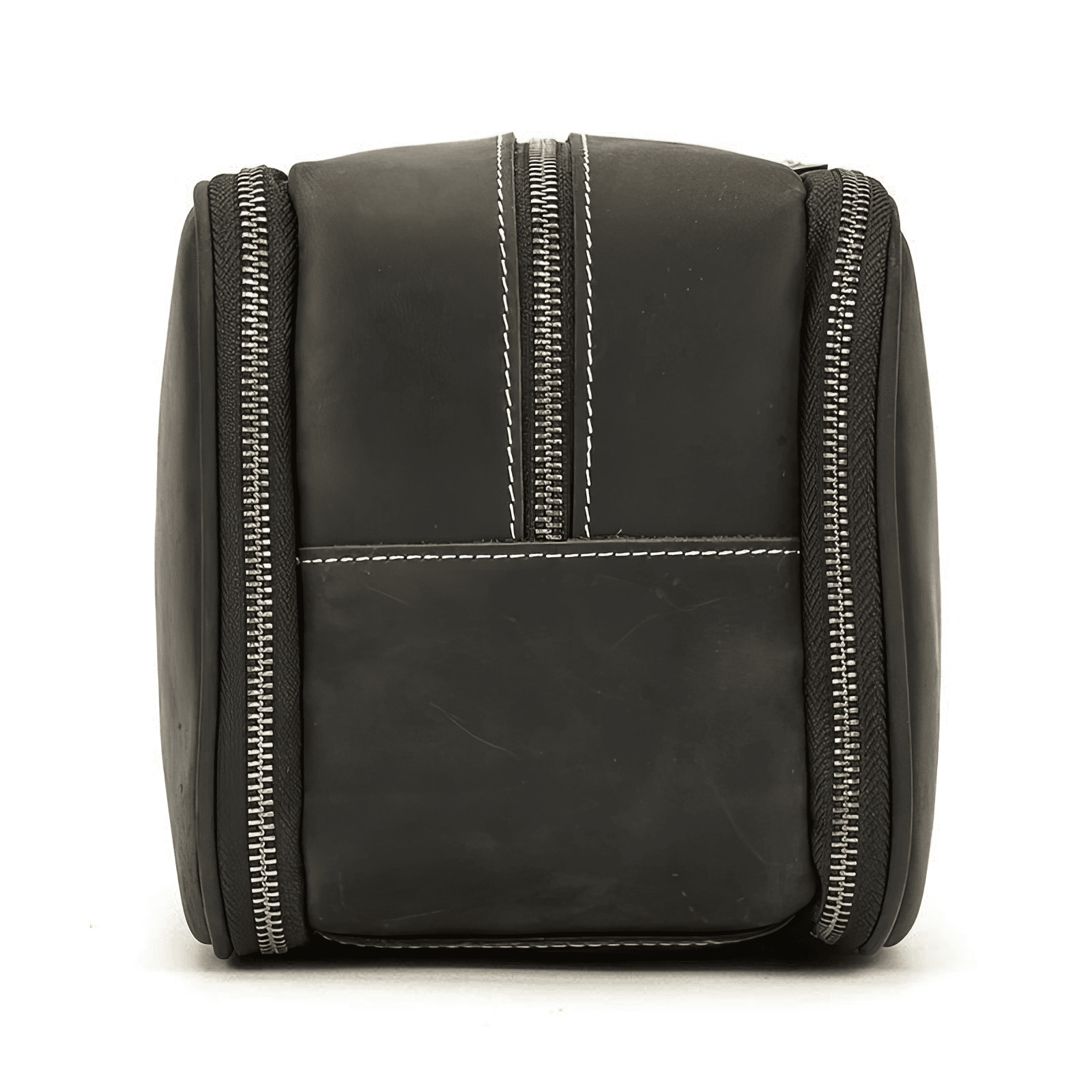 Trousse de toilette homme cuir luxe marron foncé vue latérale, poignée en cuir renforcé et couture claire apparente.